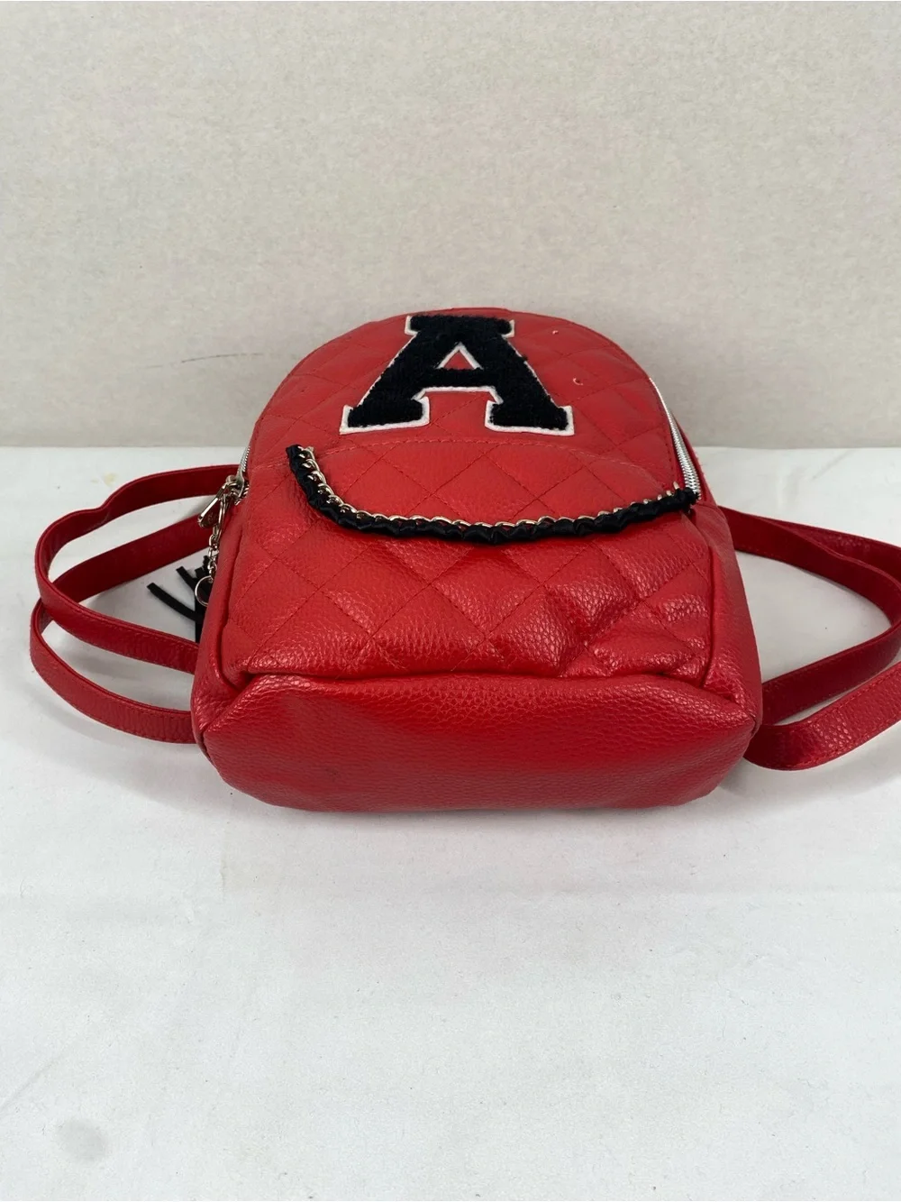 Justice Red Quilted Mini Backpack with Black Patch